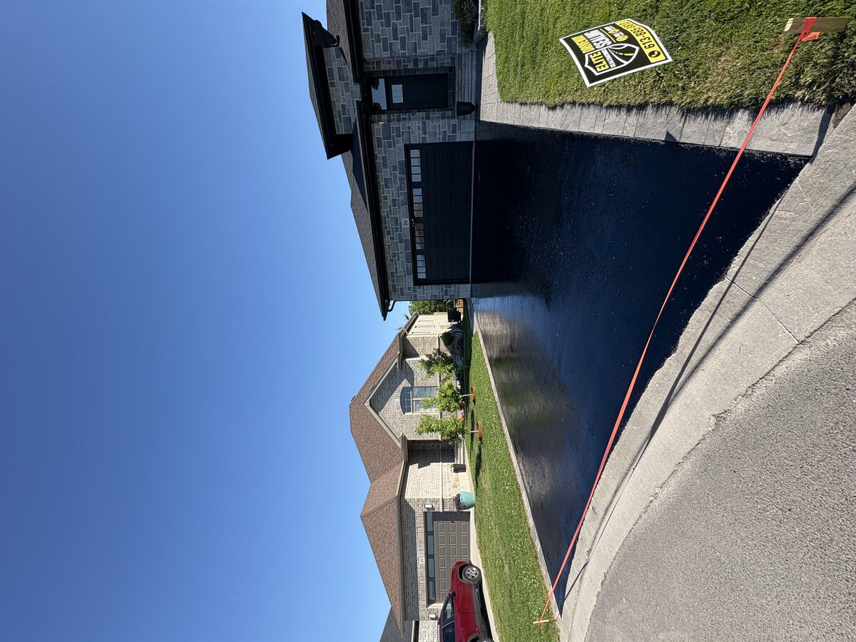 Driveway sealing with Elite yard sign