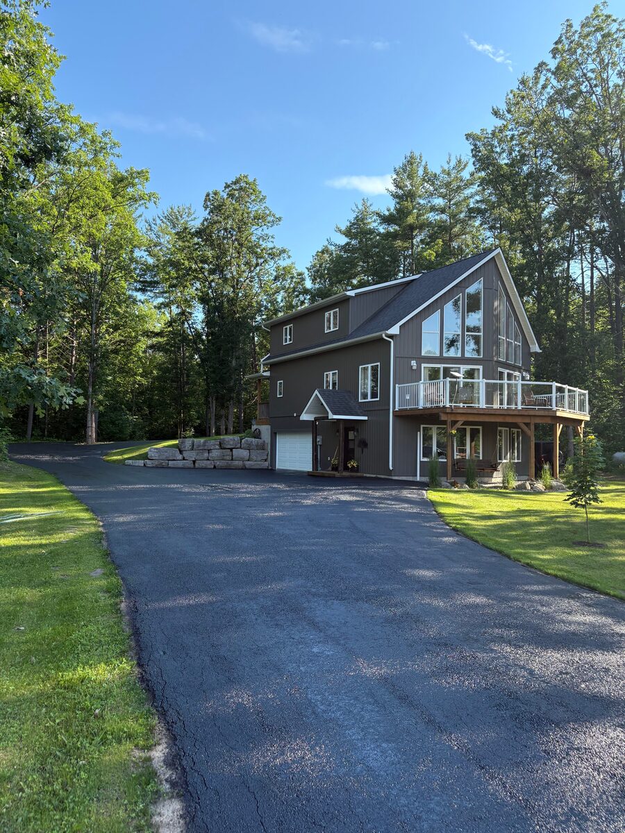 Long driveway sealcoating in rural property