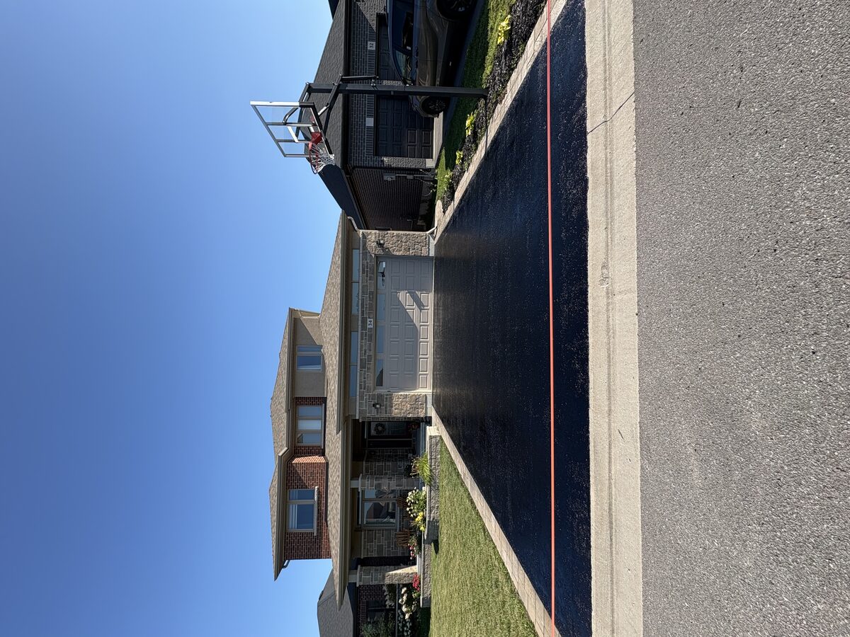 Completed sealcoating job with clean edges